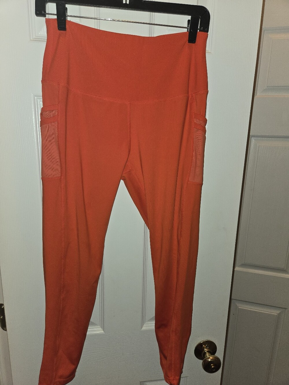 High-Rise Orange Performance Leggings with Side Phone Pockets